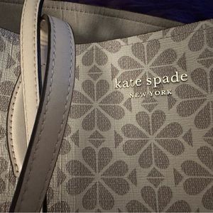 Kate spade flower tote with attached wallet. Very cute. Almost never used